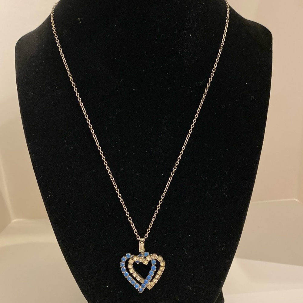 Silver tone chain necklace with two heart pendants